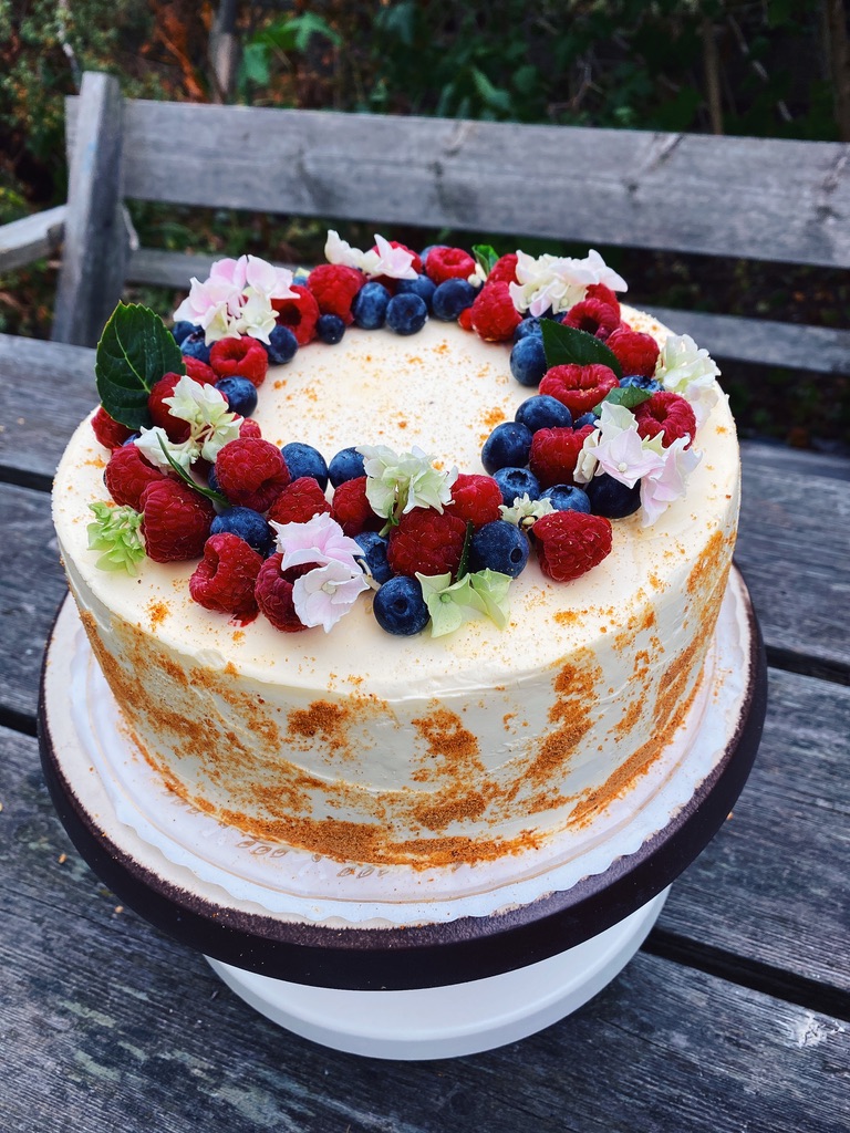 a cake with berries on top