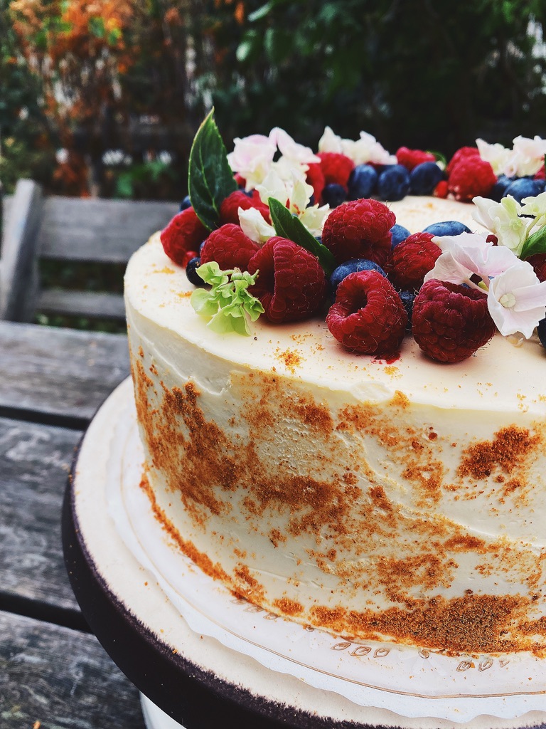 a cake with berries on top